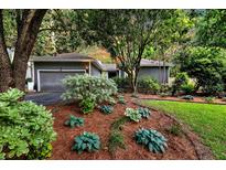 Charming single-story home with well-manicured front yard and mature landscaping at 8 Pony Ln, Charleston, SC 29407