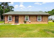 Charming brick home with well-maintained lawn, inviting curb appeal at 109 Rahway Rd, Goose Creek, SC 29445