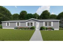 Charming single-story home with gray siding, well-manicured lawn, and inviting landscaping at 282 Marion Rd, Dorchester, SC 29437