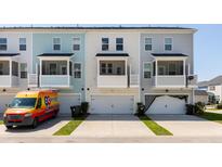 View of townhome exteriors with garages and balconies; note the varying neutral color schemes at 304 Pathfinder Way, Charleston, SC 29492