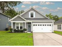 Charming single-Gathering home featuring a well-manicured lawn and a two-car garage at 3257 Timberline Dr, Johns Island, SC 29455
