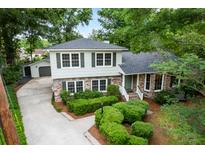 Charming two-story home with a brick base and beautiful landscaping at 886 Friendly Cir, Charleston, SC 29414