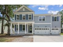 Charming two-story home with blue shutters and a welcoming front porch at 2006 Riverbend Dr, Charleston, SC 29412