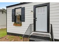 Charming front entrance with black and white trim, a window box and three steps at 2317 Kent Ave, North Charleston, SC 29405