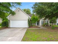 Charming single-Gathering home featuring a two-car garage and mature landscaping at 2845 August Rd, Johns Island, SC 29455
