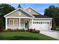 Charming single-Gathering home features a landscaped front yard, a covered porch, and a two-car garage with a green front door at 109 Indigo Cove Blvd, Summerville, SC 29486
