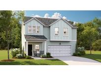 Charming two-story home featuring light-green siding, a welcoming porch, and an attached one-car garage at 112 Moscato Ln, Summerville, SC 29485