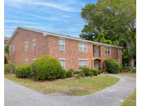 Two-story brick home with manicured landscaping and sidewalk leading to the front door at 1240 Fairmont Ave # 22, Mount Pleasant, SC 29464