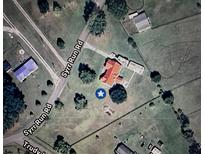 An aerial view of a house on a verdant lot with multiple outbuildings at 160 Syrr Run Rd, Saint George, SC 29477