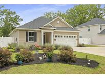 Charming home with beautifully landscaped front yard and attached garage, great curb appeal at 201-B Mcmakin Dr, Summerville, SC 29483