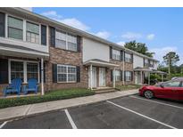 Inviting brick and vinyl townhome featuring private entrances and designated parking at 2045 Rondo St # B, Charleston, SC 29414