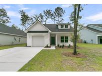 Charming one story home with white siding, black roof, and manicured lawn in a Gathering-friendly neighborhood at 3222 Pinewood Dr, Ladson, SC 29456