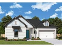 Charming single-story home with a mix of white siding and a nicely manicured front lawn and a two car garage at 330 Trailmore Ln, Summerville, SC 29486