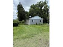 Exterior view of a single story home with large trees and green yard at 7413 N Highway 17, Awendaw, SC 29429