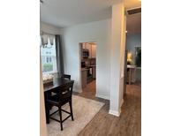 Inviting dining area with a dark wood table set and plush rug at 9410 Sweep Dr, Summerville, SC 29485
