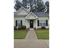 Charming single-story home with a manicured lawn and inviting front porch at 103 Dupont Way, Summerville, SC 29485