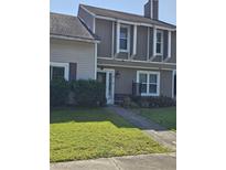 Charming home featuring light colored wood and a manicured lawn, providing inviting curb appeal at 11 Hunters Ct, Goose Creek, SC 29445