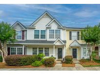 Inviting townhome exterior with manicured landscaping and traditional architectural details at 1401 Elm Hall Cir, Summerville, SC 29483