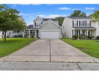 Charming two-story home with a driveway and lawn at 2005 Isabela Ct, Summerville, SC 29483