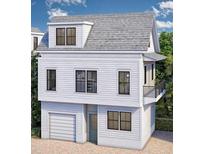 Charming two-story home with a garage and balcony, surrounded by lush greenery at 1 Nats Ct, Charleston, SC 29403