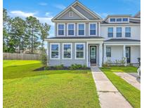 Charming two-story home with manicured lawn and inviting entryway, great curb appeal at 184 Kirkland St, Goose Creek, SC 29445