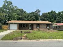 Charming brick home with a well-manicured lawn and a classic mailbox at 2 Clarksville Ln, Goose Creek, SC 29445