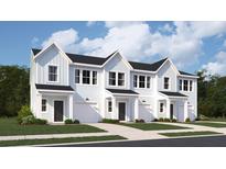 Charming exterior view of new build townhomes with light blue siding and a one car garage at 205 Agrarian Ave, Summerville, SC 29485