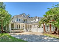 Charming two-story home with a large front yard, two-car garage and inviting front porch at 2701 Fountainhead Way, Mount Pleasant, SC 29466