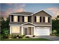 Charming two-story home featuring a two-car garage, classic design, and attractive curb appeal at 725 Meadowbrook Ln, Summerville, SC 29486