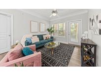 Bright living room features modern decor, plush seating, and ample natural light at 1012 Basildon Rd, Mount Pleasant, SC 29466