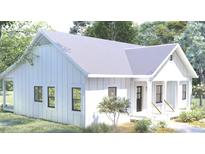 Charming one-story home featuring white siding, a covered porch, and black framed windows at 1219 Pineville Cir, Pineville, SC 29468