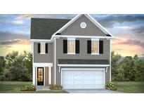 Charming two-story home with gray siding, black shutters, and a two-car garage at 217 Seele St, Summerville, SC 29485