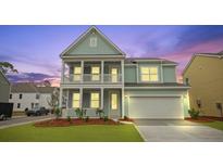 Charming two-story home with a welcoming double porch and a well-maintained front yard at 226 Seele St, Summerville, SC 29485