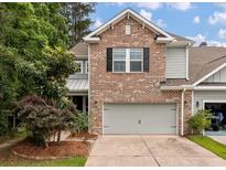 Beautiful home featuring brick, siding, a two-car garage, and professionally landscaped front yard at 2688 Jacana Ct, Mount Pleasant, SC 29466