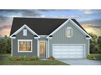 Charming one-story home with a two-car garage, well-maintained lawn, and flowerbeds at 343 E Dickerson Ln, Summerville, SC 29485