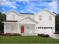 Charming two-story home featuring a bright red front door, attached two-car garage, and landscaped yard at 422 Radiant Blue Way, Summerville, SC 29486
