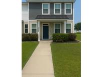 Inviting two-story home with a charming entrance and well-maintained landscaping, offering a warm and welcoming curb appeal at 7788 Montview Rd, North Charleston, SC 29418