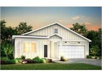 Charming one-story home with white siding, gabled roof, a well-manicured lawn, and an attached garage at 782 Meadowbrook Ln, Summerville, SC 29486