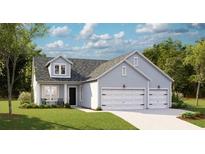 Charming single-story home featuring a two-car garage, well-manicured lawn, and inviting curb appeal at 1130 Darling St, Summerville, SC 29485