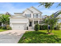 Charming two-story home with a well-manicured lawn, a two car garage and inviting front porch at 2152 Pentland Dr, Charleston, SC 29412