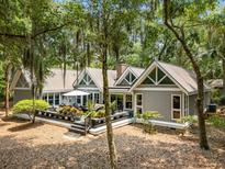 Charming home exterior with a spacious deck, perfect for outdoor living and entertaining at 2500 The Bent Twig, Seabrook Island, SC 29455