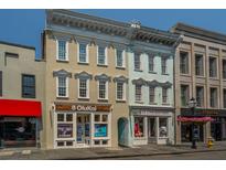 Beautiful boutique commercial property with well-maintained facade and sidewalk flower display at 338 King St # C, Charleston, SC 29401