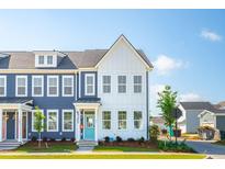 Charming townhomes showcasing craftsman-style architecture with eye-catching blue and white exteriors at 757 Blueway Ave, Summerville, SC 29486