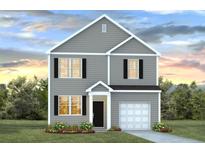 Charming two-story home with gray siding, black shutters, and a well-manicured lawn at 8021 Rackham Rd, Hollywood, SC 29470