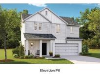 Charming two-story home featuring a two-car garage, covered front porch, and a well-manicured lawn at 107 Lefton Lndg, Summerville, SC 29485