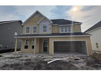 New two-story home featuring a spacious two-car garage and unfinished landscaping at 119 Crosscut Ln, Summerville, SC 29486