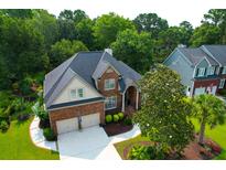 Beautiful brick home with a two-car garage and a well-maintained lawn at 2791 Gaston Gate, Mount Pleasant, SC 29466