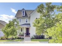 Charming two-story home featuring manicured landscaping and a welcoming front porch perfect for relaxing at 312 Greenhouse, Summerville, SC 29485