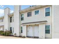 Charming townhouse with neutral siding, and a manicured garden, offering a welcoming curb appeal at 201 Pine Shadow Dr, Goose Creek, SC 29445