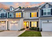 Charming townhome with neutral siding, black shutters, and manicured front lawn in a residential neighborhood at 2582 Kingsfield St, Mount Pleasant, SC 29466